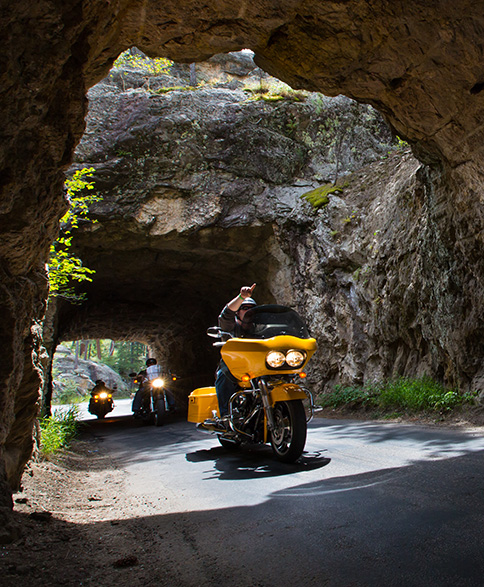 Bikes Riding Through Tunnel